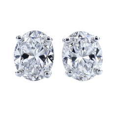 PNG of Elegant pair of oval diamond earrings shining brilliantly on transparent background