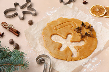 Composition with raw dough, spices and cutters for preparing tasty Christmas cookies on color background