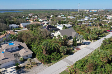 Aerial looking north over New Smyrna Beach, Florida towards Ponce Inlet , Florida neighborhoods, beachfront hotels and condos and the Atlantic Ocean.