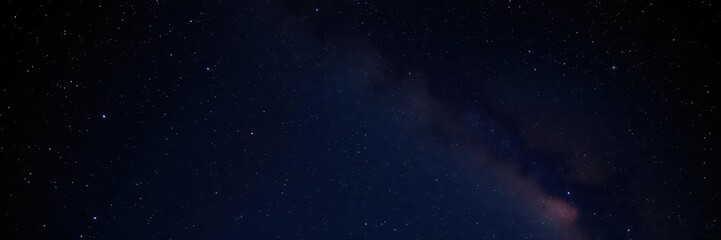 Obraz premium Night sky filled with sparkling stars on a black background, outer space, starlight