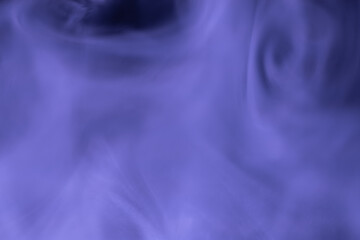 Abstract composition of soft purple smoke patterns flowing gently, creating a dreamy and tranquil atmosphere with subtle motion and texture.