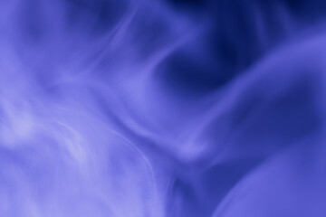 Abstract composition of soft purple smoke patterns flowing gently, creating a dreamy and tranquil atmosphere with subtle motion and texture.
