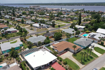 Aerial looking west over Daytona Beach, Florida residential neighborhoods and the Intracoastal Waterway.