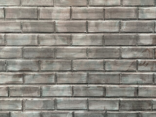 Old gray brick wall, structure suitable as background