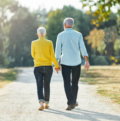 woman man outdoor senior couple retirement together walking love holding hands support old nature...