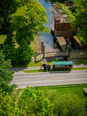 Horse-drawn wagon traveling in countryside. Carriage ride in countryside. Horse-drawn wagon pauses...