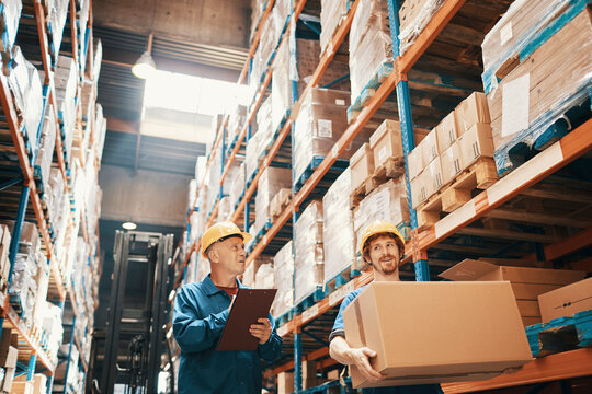 Warehouse workers organizing boxes and inventory management
