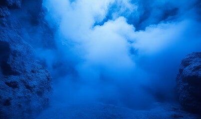 Fototapeta premium The cave is filled with blue fog, creating an eerie and dark atmosphere.