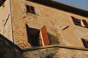 Window with brown shutters.
