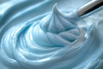 A close-up shot of blue icing on a spoon, great for food and dessert related content