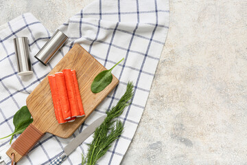 Wooden board with tasty crab sticks, spinach leaves and dill on white background © Pixel-Shot