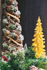 festive Christmas arrangement featuring golden and rustic trees, pine garlands, and holiday accents...