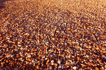 Bright red-brown gravel that often used in decorative xeriscaped grounds, background or backdrop 