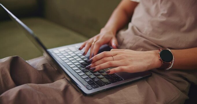 Laptop, hands typing and remote work in home for news story, report and journalist editing article. Sofa, freelancer and woman on computer for writing email, research and online publication closeup