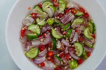 Vinegar with sugar, cucumber, shallots and chili, ready to eat.