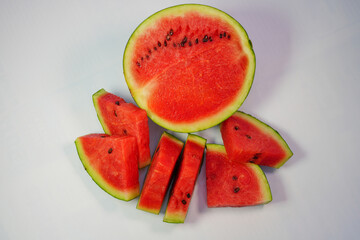 Watermelon cut open to reveal red inside, ready to eat