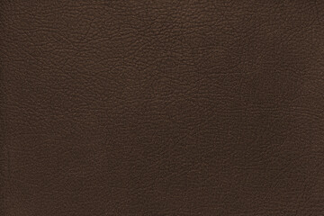 Natural, genuine solid brown leather texture close up, macro. Structure of matte leatherette, artifical skin surface with embossing pattern. Background, wallpaper, backdrop