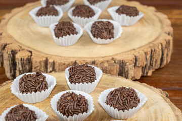 Brazilian chocolate truffle on wooden plates. Traditional Brazilian sweet_4.
