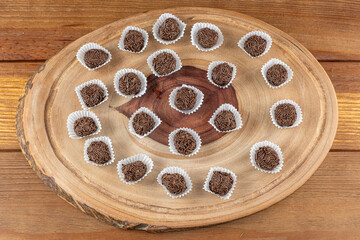 Brazilian chocolate truffle on wooden plates. Traditional Brazilian sweet_6.