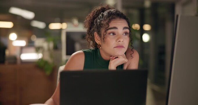 Bored, computer and depression with designer woman in office at night for project deadline. Exhausted, fatigue or tired with creative employee in workplace for programming or web development