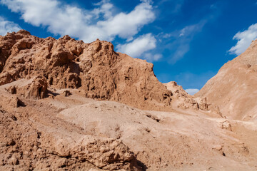 Valle de la Luna in San Pedro de Atacama desert, Chile. The Moon valley or Valley of the Moon arid soil and red rock landscape in Atacama desert