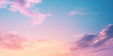 A serene sky at dusk, showcasing soft clouds and a gradient of pastel colors.