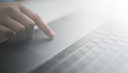 Close up hand of woman finger typing on laptop computer keyboard and surfing the internet on office. Female using laptop online and working. Business and technology, internet communication concept.