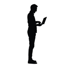 Silhouette of a man using a laptop