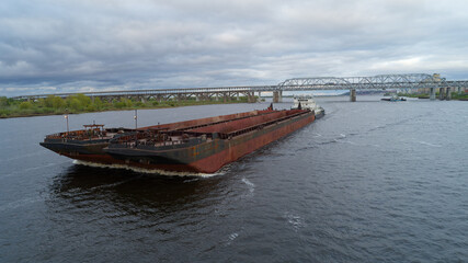 Large ship is traveling down a river