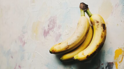 fresh bananas arranged on a textured pastel background ideal for food blogs or healthy lifestyle concepts