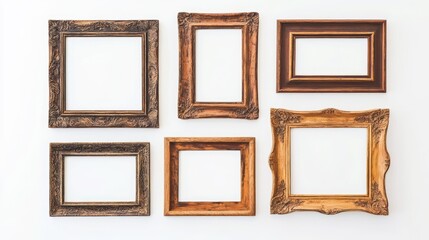 Vintage wooden picture frames arranged on a white background showcasing diverse styles and craftsmanship in interior decor.