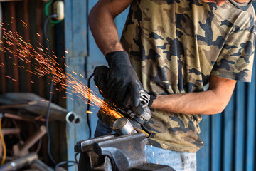 Metalworking Sparks Skilled Hands at Work with a Grinder Creating Beautiful Objects