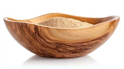 Fototapeta premium Wheat flour in an elegant wooden bowl against a clean white background, showcasing texture and color contrast, baking, culinary ingredient, natural materials, home cooking.