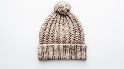 Cozy beige knit hat with a pom-pom on top, placed against a clean white backdrop, suitable for fashion, winter accessories, apparel, texture.