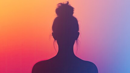Silhouette of woman with bun against colorful background.