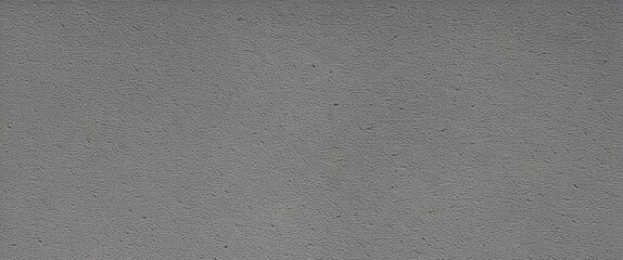 Obraz premium A textured grey fabric or surface with a subtle pattern and slight sheen.