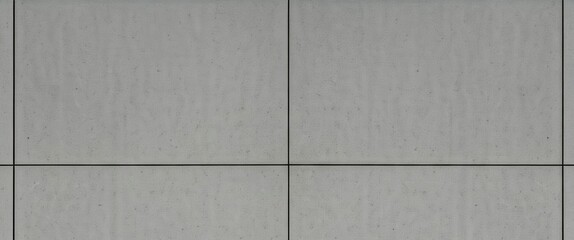 Textured gray wall tiles with visible grout lines.