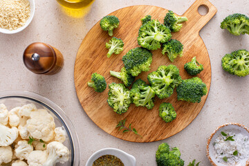 Bowl of cauliflower with broccoli, ready to be roasted, cooking with vegetables