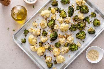 Broccoli and cauliflower roasted on a baking sheet with herbs