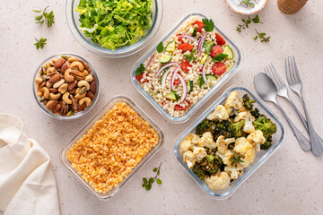 Vegan meal prep with lentils, roasted vegetables, nuts and salad