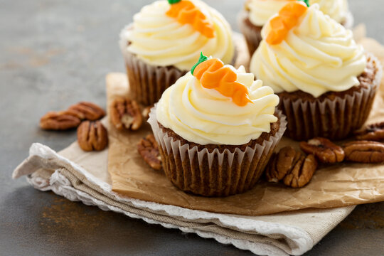 Carrot cupcakes with cream cheese frosting - Powered by Adobe