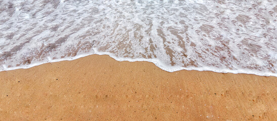 Ocean Waves Retreating on Sandy Shore
