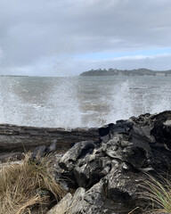 South Beach high waters splashing  drift wood on to beach. Oregon winter. 