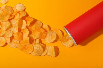 Potato chips with a red tube on a yellow background