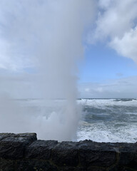 King Tides during Oregon winter are a sight to see. In Depot Bay the water surges all the way across the highway during king tide.