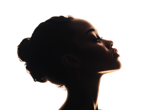 Profile silhouette of a woman against a white background, showcasing elegance and grace.