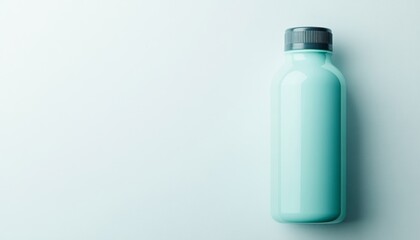 A green bottle stands alone against a plain background, showcasing its smooth design