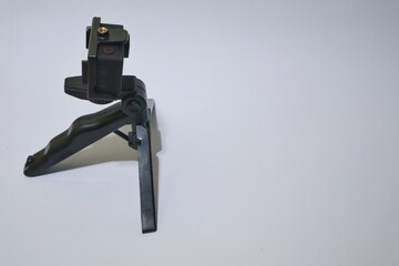 action camera with tripod accessory. isolated on grey background