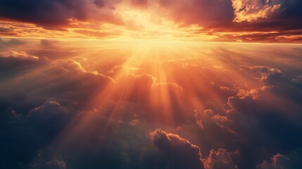 Fototapeta premium A breathtaking sunset illuminating clouds with golden rays, evoking serenity and wonder.