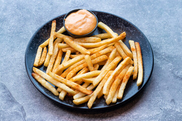 French Fry served in dish plate isolated on grey background side view of Indian and Bangladeshi food